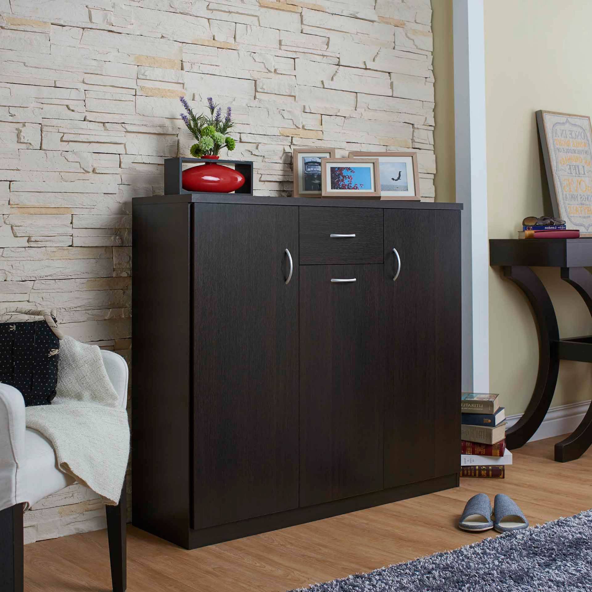 A drawer, laminated storage space, handle a special shape, entrance, dark brown